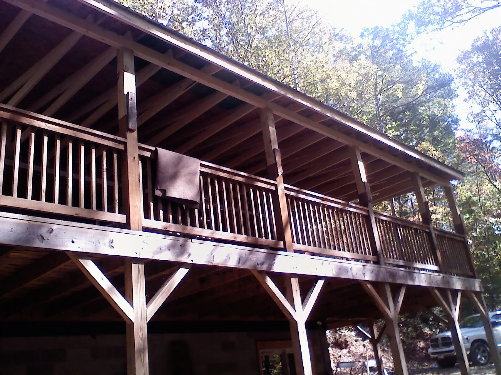 Timber framing under a new elevated porch and deck — Roof Leak Repair in Almond by Roofing Brothers